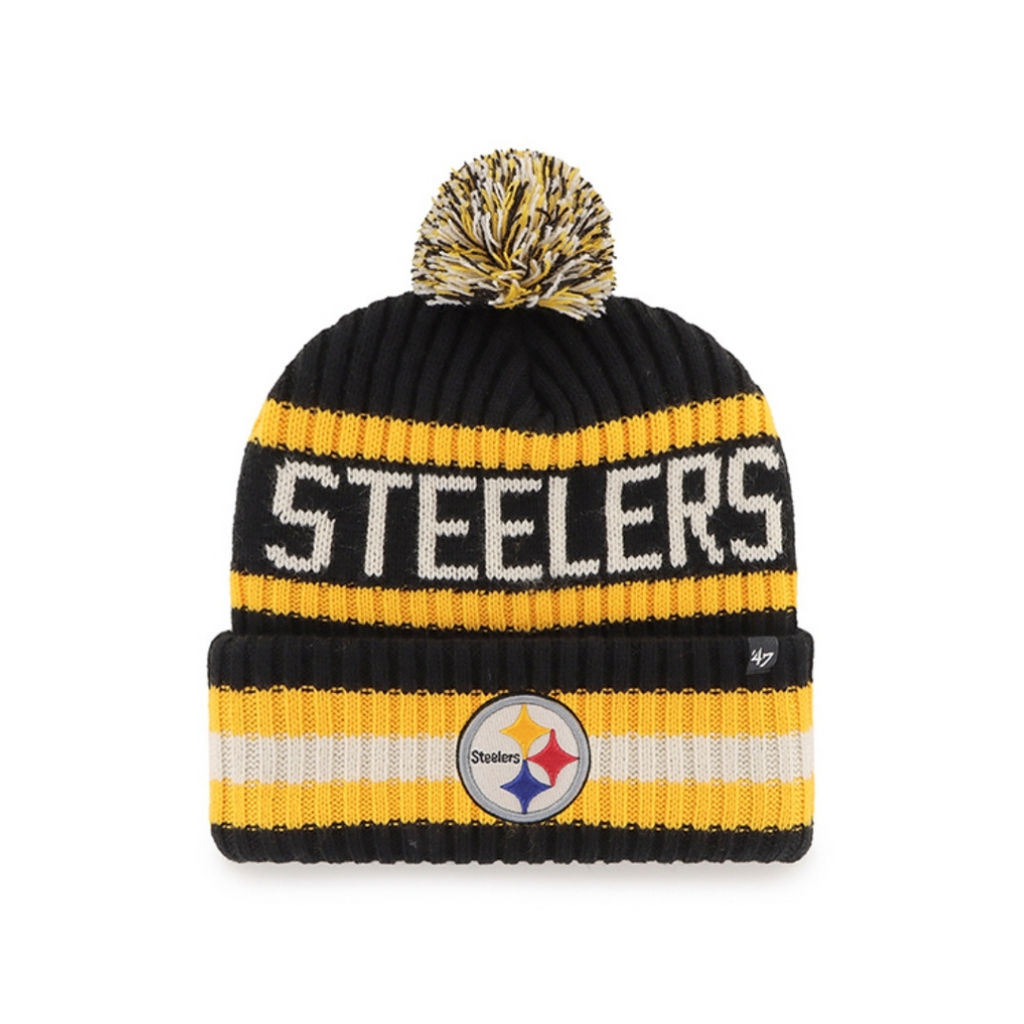 The Sideline Sport Knit from the Pittsburgh Steelers Europe Shop is a black, yellow, and white beanie with a pom-pom, STEELERS lettering, and the team logo on the front cuff.