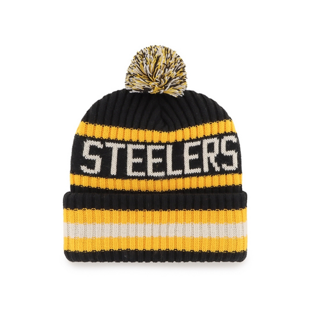 The Sideline Sport Knit from Pittsburgh Steelers Europe Shop is a black beanie with yellow and white stripes, a pom-pom on top, and STEELERS in bold white letters across the front.